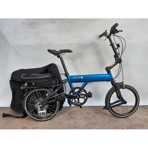 288 - A BAGGED BLACK AND BLUE MEZZO D9 FOLDING BICYCLE WITH LIGHTWEIGHT ALLOY FRAME, QUICK RELEASE WHEELS ... 