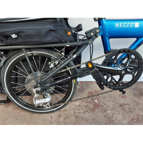 288 - A BAGGED BLACK AND BLUE MEZZO D9 FOLDING BICYCLE WITH LIGHTWEIGHT ALLOY FRAME, QUICK RELEASE WHEELS ... 