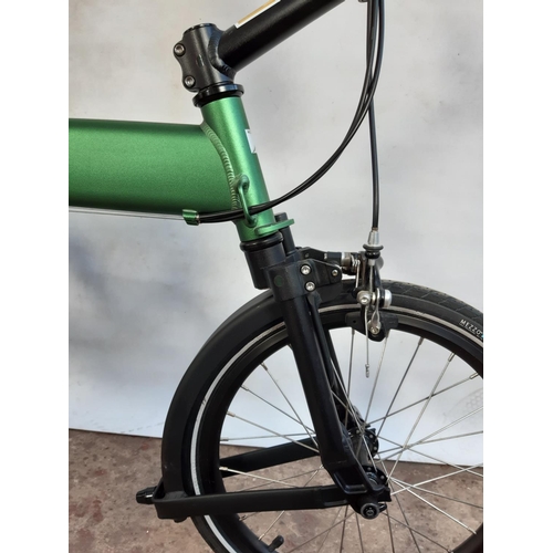 289 - A BAGGED GREEN AND BLACK MEZZO D9 FOLDING BICYCLE WITH LIGHTWEIGHT ALLOY FRAME, QUICK RELEASE WHEELS... 