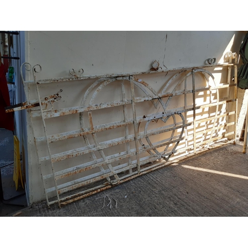 304 - A PAIR OF WHITE PAINTED WROUGHT IRON GATES - MEASURING APPROX. 107