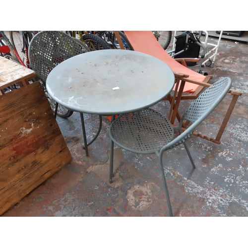 314 - THREE ITEMS TO INCLUDE A GREY METAL CIRCULAR GARDEN TABLE WITH TWO MATCHING CHAIRS