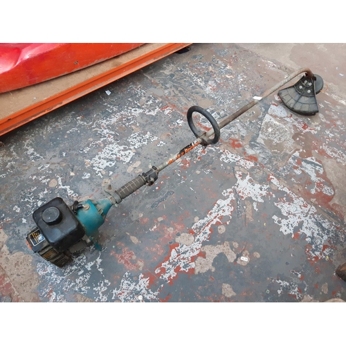 336 - A GREEN BLACK & DECKER PETROL STRIMMER