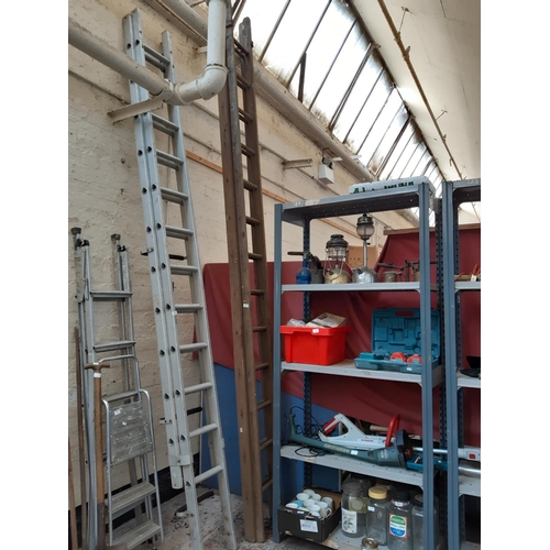 361 - A SET OF WOODEN 26 RUNG DOUBLE EXTENDABLE WORK LADDERS