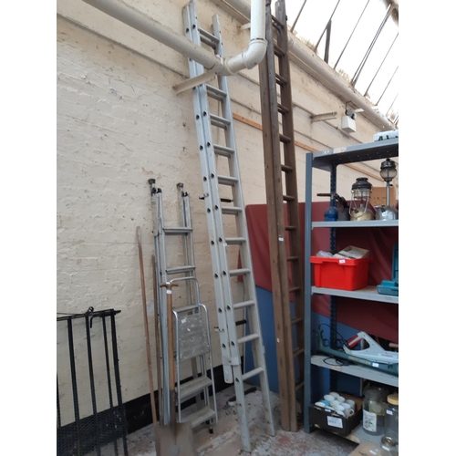 362 - A SET OF ALUMINIUM 24 RUNG DOUBLE EXTENDABLE WORK LADDERS