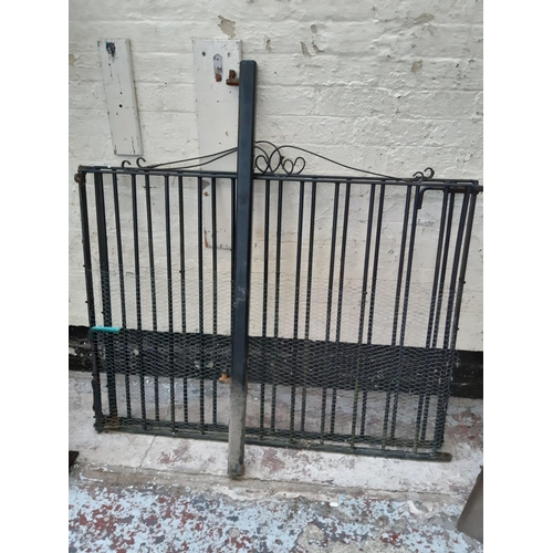 364 - A PAIR OF BLACK PAINTED METAL GARDEN GATES - MEASURING APPROX. 4' X 3'6 WITH POST