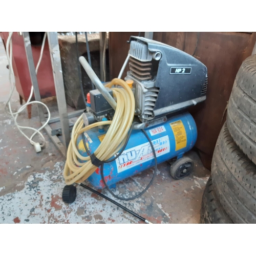 394 - A BLUE NU AIR HP2 AIR COMPRESSOR WITH HOSE AND TYRE INFLATOR