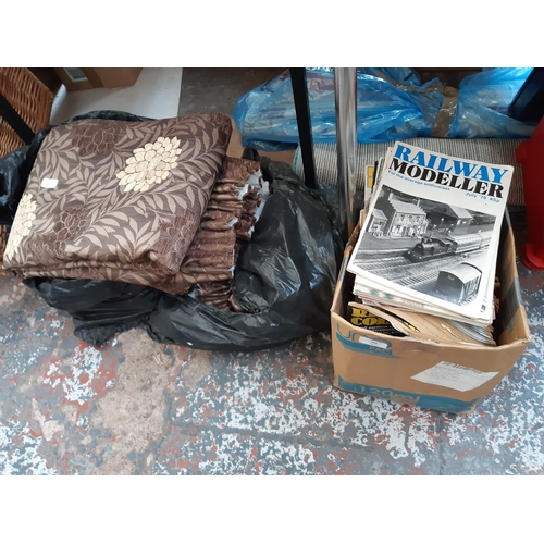 409 - A BOX CONTAINING A LARGE QUANTITY OF MODEL RAILWAY MAGAZINES AND FLORAL CURTAINS