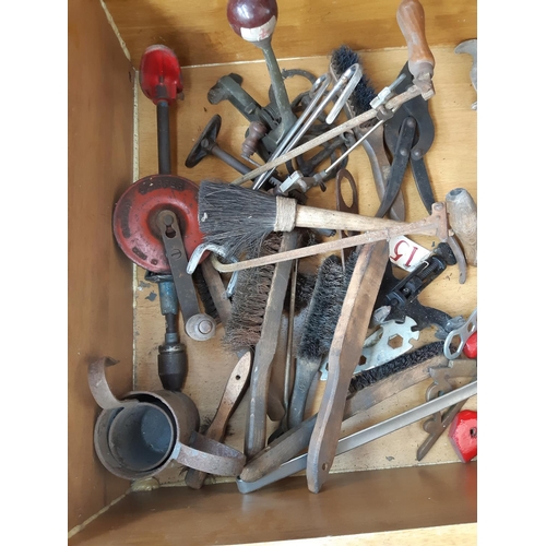 445 - A LARGE WOODEN BOX CONTAINING HAMMERS, CLIPPER HAND DRILL, WIRE BRUSHES, AXES ETC.