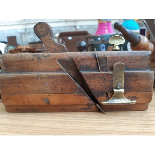 94 - TWO 19TH CENTURY WOOD PLANES TO INCLUDE A WATSONS OF LEEDS MOVING FILLISTER PLANE AND A SCREW STEM S... 