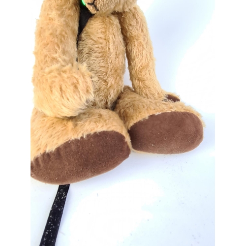 261 - A VINTAGE STYLE BLONDE TEDDY BEAR WITH BLACK RIBBON