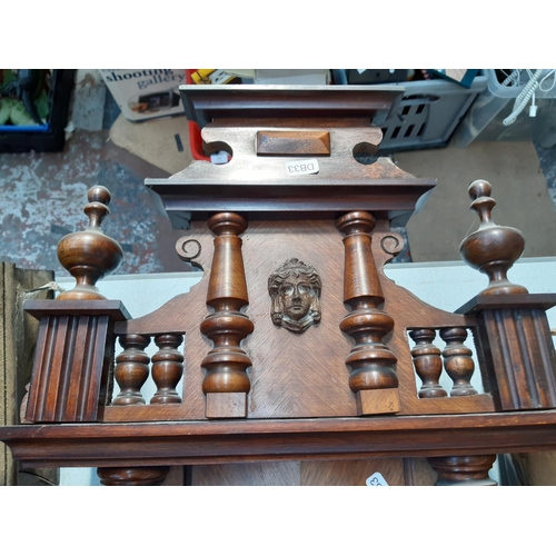 145 - A VICTORIAN MAHOGANY CASED CHIMING VIENNA WALL CLOCK WITH WHITE ENAMEL FACE, KEY AND PENDULUM