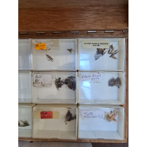 422B - A BOX CONTAINING A LARGE QUANTITY OF FLIES TOGETHER WITH FLY TYING THREADS, INVISIBLE LINE AND VARIO... 