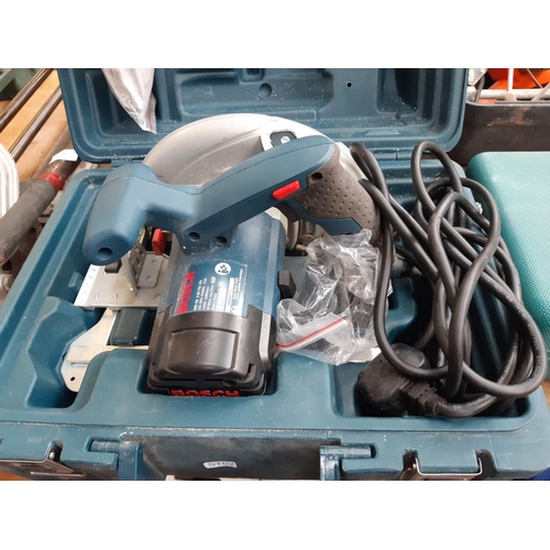 174 - A CASED BLUE BOSCH GKS 190 MAINS ELECTRIC HANDHELD CIRCULAR SAW WITH MANUAL