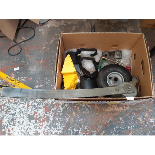 210 - A BOX CONTAINING CARAVAN TOWING MIRRORS, CHOCKS, JOCKEY WHEEL, STABILIZER BAR ETC.