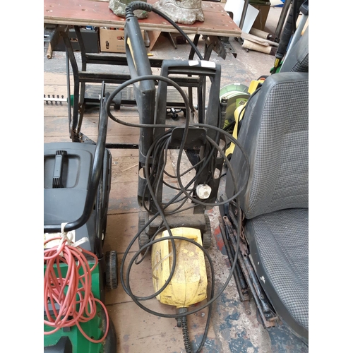 294 - A BLACK AND YELLOW KARCHER B302 ELECTRIC PRESSURE WASHER WITH HOSE AND LANCE