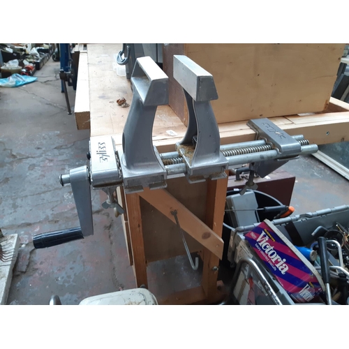 306 - A WOODEN WORKBENCH WITH MOUNTED RECORD 9