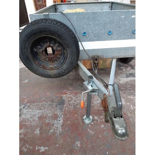 31 - A TRELGO GALVANISED TWO WHEELED TIPPING CAR TRAILER WITH LIGHTBOARD, SPARE WHEEL AND NEW JOCKEY STAN... 