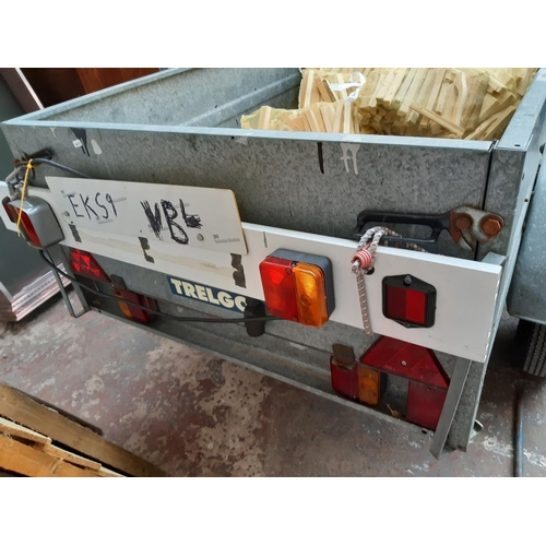 31 - A TRELGO GALVANISED TWO WHEELED TIPPING CAR TRAILER WITH LIGHTBOARD, SPARE WHEEL AND NEW JOCKEY STAN... 
