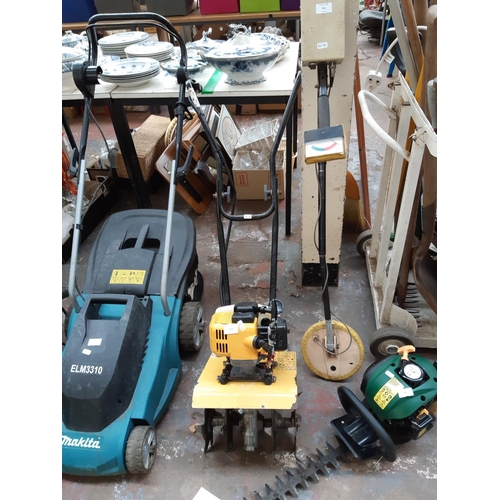 312 - A BLACK AND YELLOW PETROL ROTAVATOR