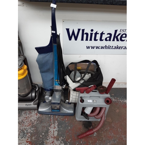 319 - A KIRBY TRADITIONAL INDUSTRIAL VACUUM CLEANER WITH A LARGE SELECTION OF TOOLS AND ACCESSORIES