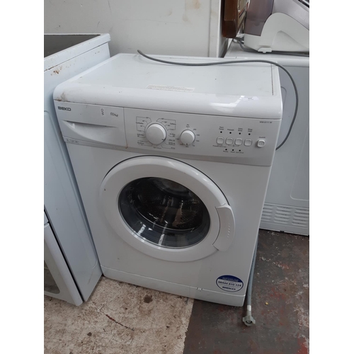 324 - A BEKO WM6111W 6KG SLIMLINE WASHING MACHINE