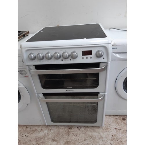 325 - A HOTPOINT ULTIMA HUE61 ELECTRIC COOKER WITH TWIN GRILL, DOUBLE OVEN AND MAIN OVEN WITH FAN