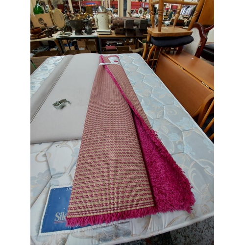 917 - AN IKEA HAMPEN FUSCHIA RUG - MEASURING APPROX. 133CM X 195CM