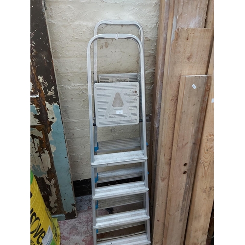 112 - TWO SETS OF FIVE TREAD ALUMINIUM STEP LADDERS TO INCLUDE ONE BELDRAY AND ONE OTHER