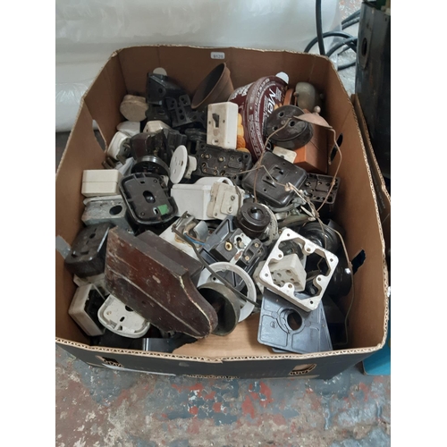 182 - FOUR MIXED BOXES CONTAINING VINTAGE BAKELITE LIGHT SWITCHES, PLUMBING ITEMS, PLUG SOCKETS ETC.