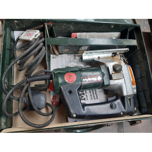 200 - A CASED GREEN AND BLACK METABO ELECTRIC JIGSAW