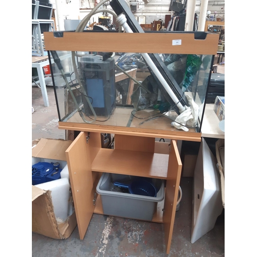 229 - A MODERN JUWEL BEECH AND GLASS FISH TANK ON CABINET STAND TOGETHER WITH A LARGE QUANTITY OF ACCESSOR... 