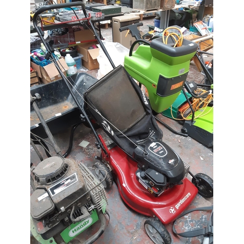 247 - A BLACK AND RED GARDENCARE PETROL LAWN MOWER WITH BRIGGS & STRATTON ENGINE AND GRASS BOX