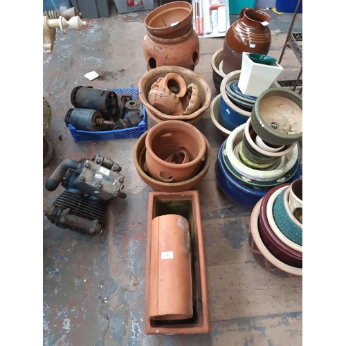 256 - A LARGE QUANTITY OF TERRACOTTA PLANTERS TO INCLUDE RECTANGULAR, CIRCULAR, BOWLS ETC.