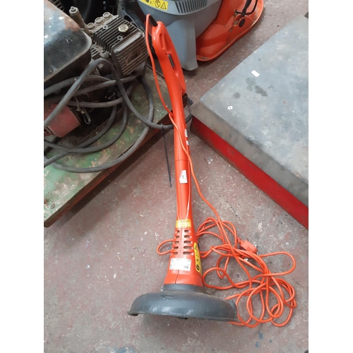 264 - AN ORANGE AND GREY FLYMO MINI TRIM ELECTRIC STRIMMER