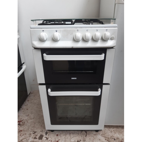 295 - A BLACK AND WHITE ZANUSSI 50CM GAS COOKER