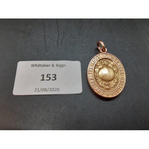 153 - A hallmarked 9ct gold medal awarded to George Wilson for captaining the English Football League XI i... 