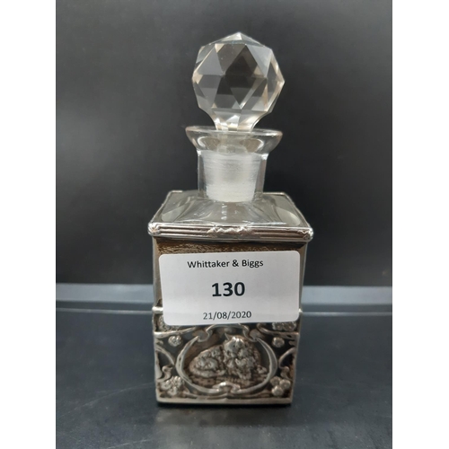 130 - A cut glass and hallmarked Sheffield silver perfume bottle with embossed cat design and original sto... 