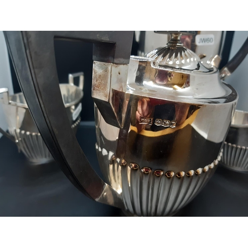 137 - An excellent quality hallmarked Sheffield silver Walker & Hall four piece tea and coffee set compris... 