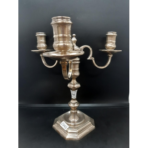142 - A hallmarked Birmingham solid silver three branch candelabra, dated 1971 and measuring approx. 24cm ... 