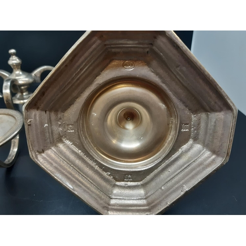 142 - A hallmarked Birmingham solid silver three branch candelabra, dated 1971 and measuring approx. 24cm ... 