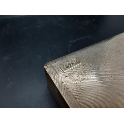 145 - A hallmarked Birmingham silver cigarette box with “EP” initials and engine turned top, dated 1937