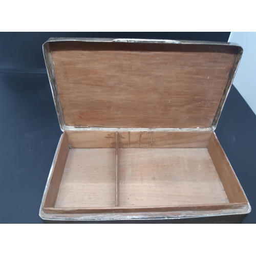 145 - A hallmarked Birmingham silver cigarette box with “EP” initials and engine turned top, dated 1937