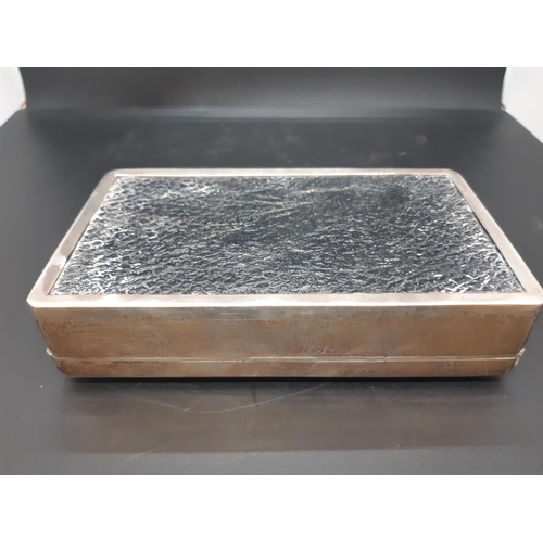 145 - A hallmarked Birmingham silver cigarette box with “EP” initials and engine turned top, dated 1937