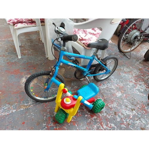 254 - Two items to include a blue Raleigh G-Force boys BMX with stabilisers together with a multi-coloured... 