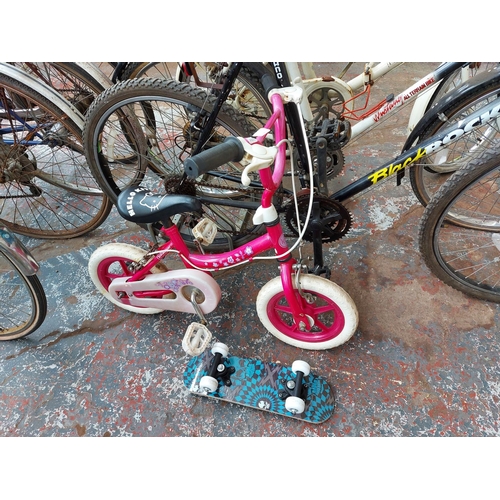 255 - Two items to include a pink Hello Kitty BMX together with a small skateboard with skull design