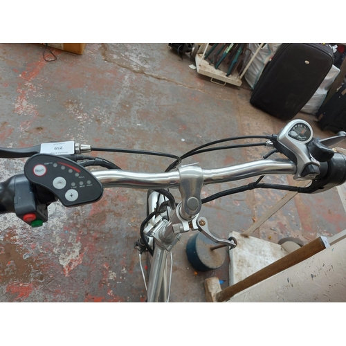 259 - A brushed aluminium Quartz ladies folding electric shopping bike with battery, lights, 7 speed shima... 