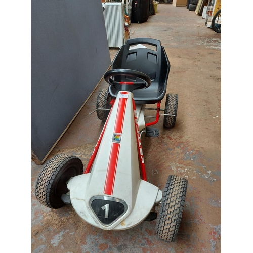 264 - A red and white Kettcar child's peddle go kart