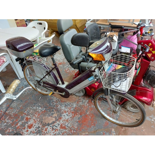 265 - A purple and grey Bouman electric scooter with front suspension, front and rear carriers, 305 miles ... 