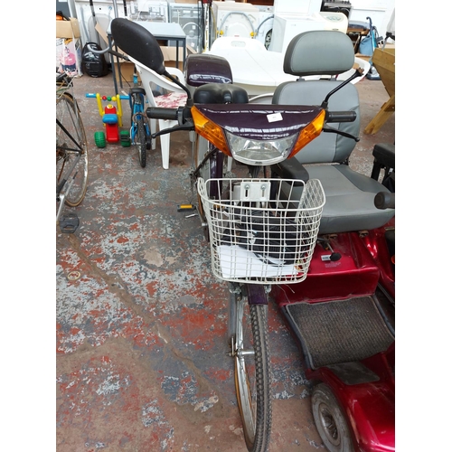 265 - A purple and grey Bouman electric scooter with front suspension, front and rear carriers, 305 miles ... 