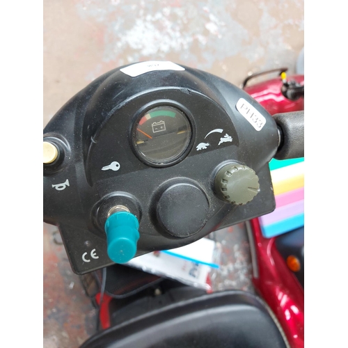 268 - A black and red lightweight Pride four wheeled ride on mobility scooter with battery, charger and in... 